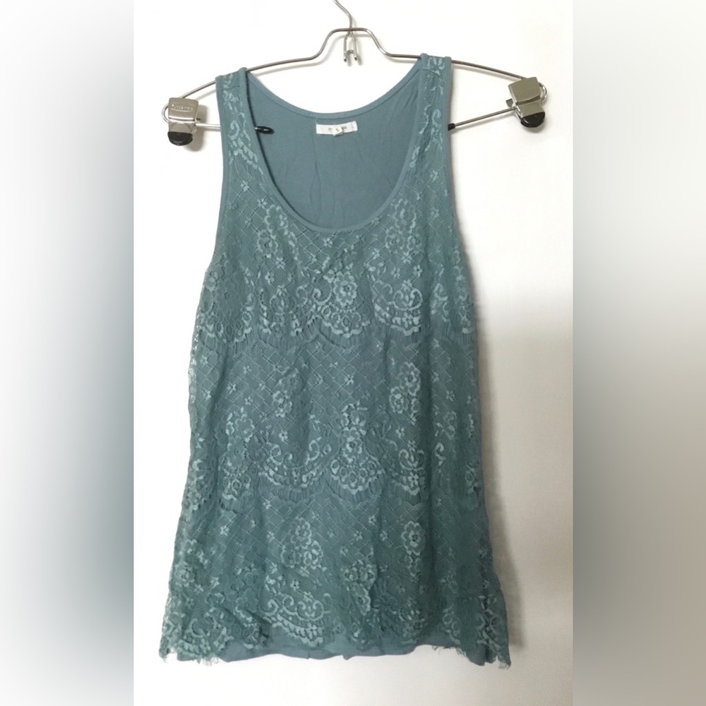 Lacy sleeveless top.
